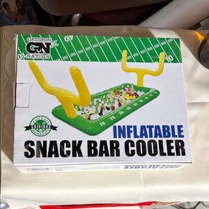 Inflatable snack bar cooler. Football field.